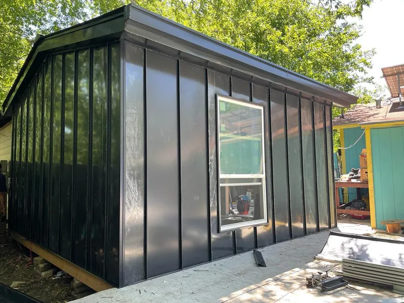 Black standing seam metal wall panels for Roof Inspection in Ellsworth